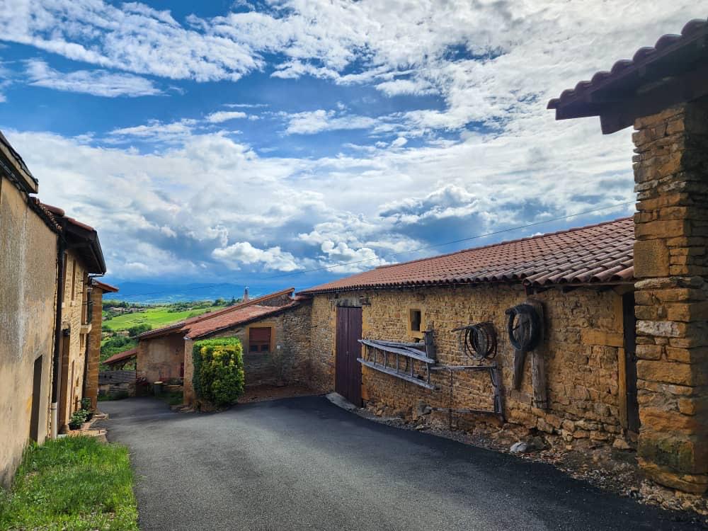 Stone village with rolling hills and blue sky in the Italian countryside