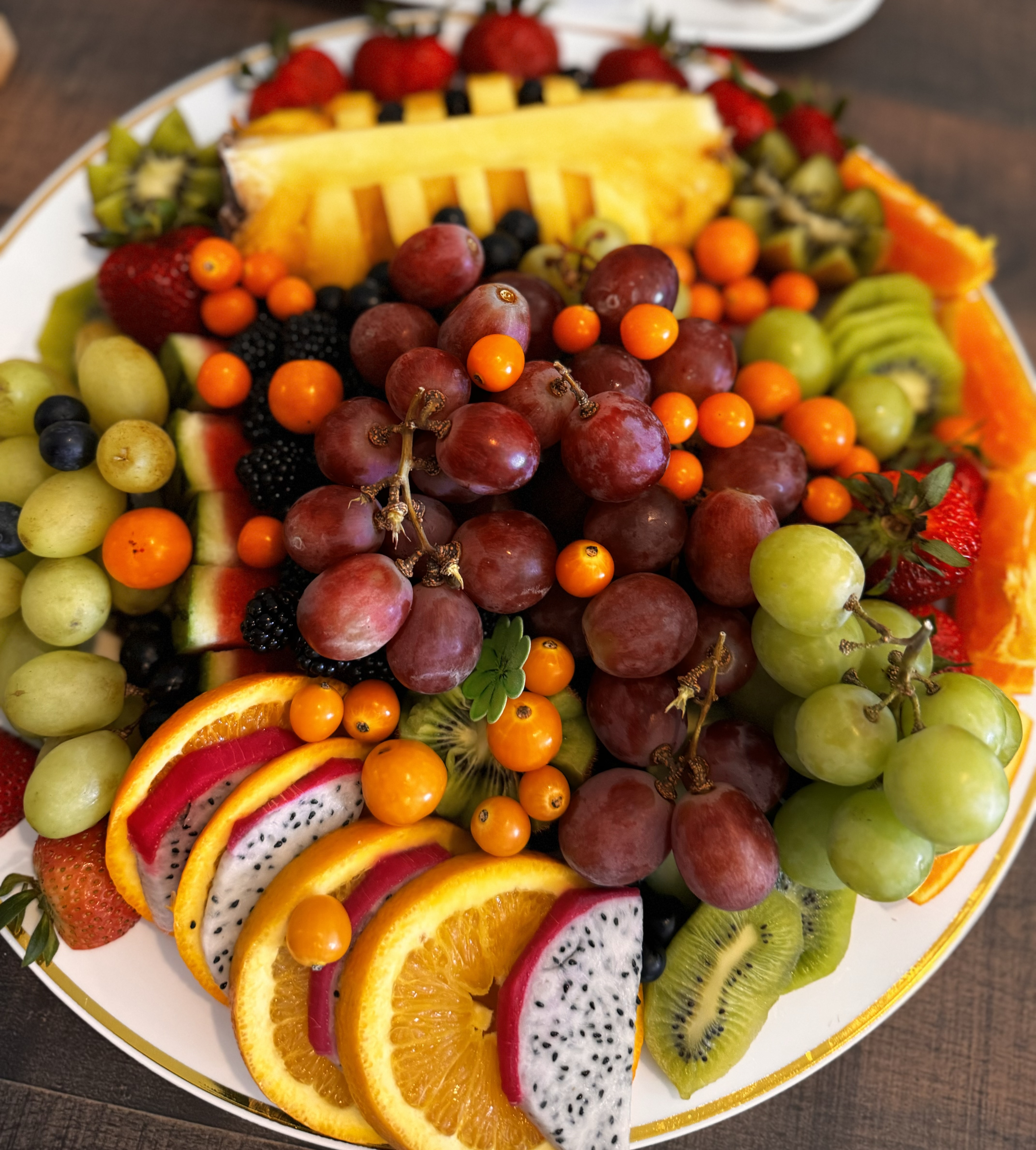 Abundant fruit platter with watermelon, grapes, strawberries and pineapple