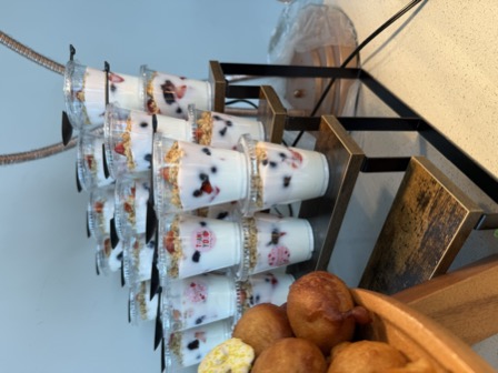 Yogurt parfait cups stacked on a display stand